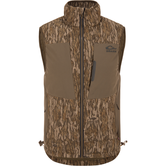 LST BMF Vest with Primaloft in Mossy Oak Bottomland camo, featuring a zip front, two chest pockets, and an adjustable hem for versatile hunting layering.