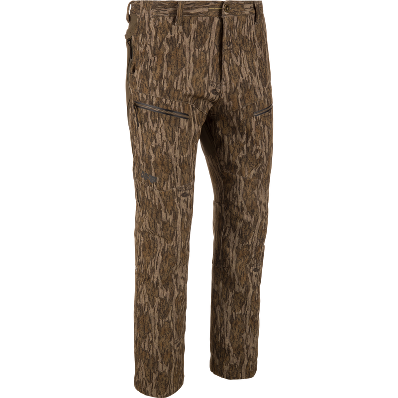 MST CommandXT Softshell Pant in camouflage pattern, featuring articulated knees, zippered thigh pockets, and stretch waistband for mobility, crafted from windproof, water-resistant softshell material with reinforced seat.