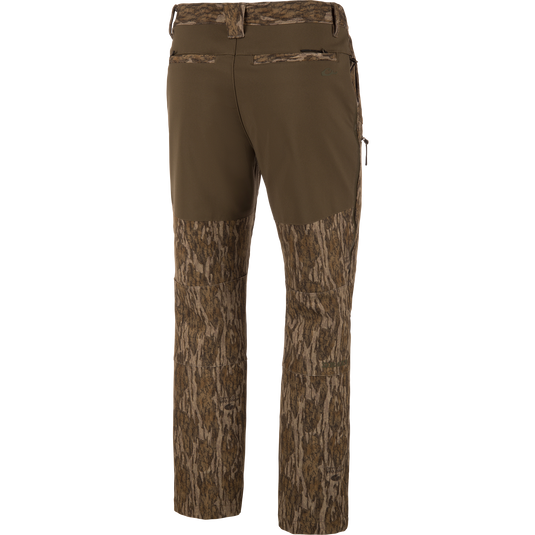 MST CommandXT Softshell Pant with bark-style camo and olive waistband, featuring belt loops, rear welt pockets, and zippered side pocket for outdoor activities.