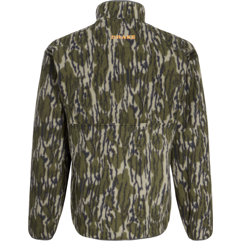 Back view of the Camp Fleece Limited Edition Snap Pullover in woodland camouflage with orange DRAKE embroidery below collar, featuring open side pockets.