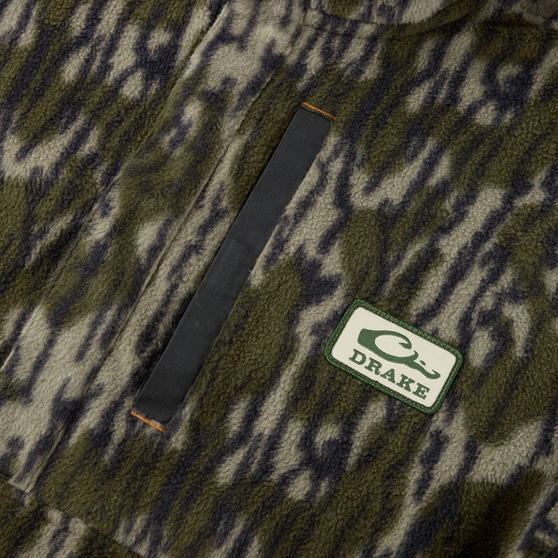 Drake Camp Fleece Limited Edition Snap Pullover featuring a camouflage pattern, black-trimmed chest pocket, and DRAKE patch, ideal for warmth and style.