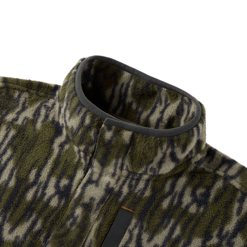 Close-up of the Camp Fleece Limited Edition Snap Pullover, showcasing its tiger-stripe camouflage fleece texture, stand-up collar, and Magnattach chest pocket detail.