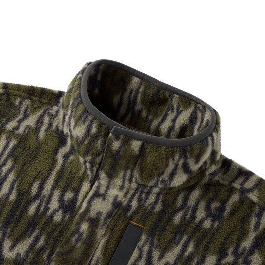 Close-up of the Camp Fleece Limited Edition Snap Pullover, showcasing its tiger-stripe camouflage fleece texture, stand-up collar, and Magnattach chest pocket detail.