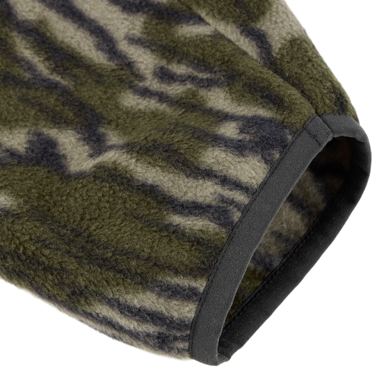 Close-up of the Camp Fleece Limited Edition Snap Pullover's sleeve in tiger-stripe camo, showcasing soft fleece texture and solid dark binding.