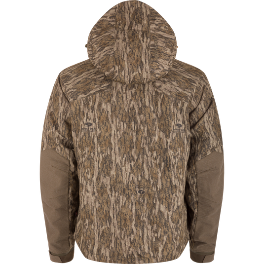 Back view of LST CommandXT 3-in-1 PrimaLoft Insulated Jacket featuring Mossy Oak Bottomland camouflage, hood, reinforced elbows, and Magnattach™ pockets, designed for versatile woodland hunting concealment.