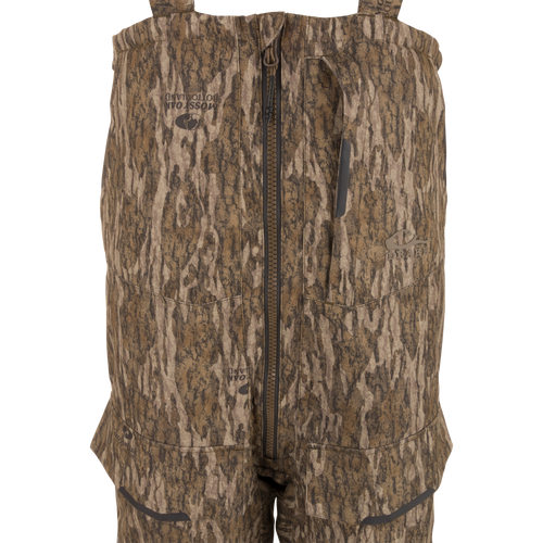 LST CommandXT Bib with Primaloft features camo-pattern, adjustable suspenders, center zipper, and reinforced panels, designed for extreme hunting conditions and durability.