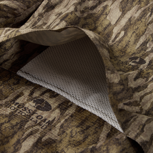 EST Wingshooter Trey Long Sleeve Shirt, featuring a hidden button-down collar, vented back, and multiple pockets, designed for outdoor activities with UPF 30 protection and moisture-wicking fabric.