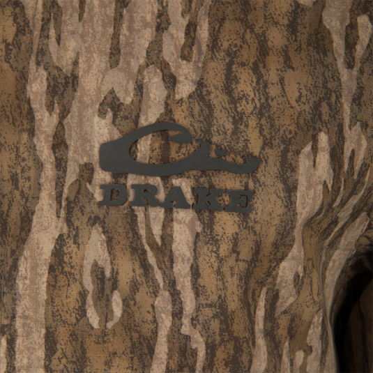 Close-up of the LST BMF Eqwader Full Zip with Primaloft, featuring a camouflage pattern and Purewhitelaneshop Systems logo, highlighting its waterproof, windproof, breathable design.