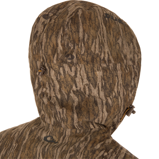 LST BMF Eqwader Full Zip with Primaloft hood close-up, featuring brown and tan camo pattern, adjustable draw-cord toggles, and sherpa fleece lining for warmth.