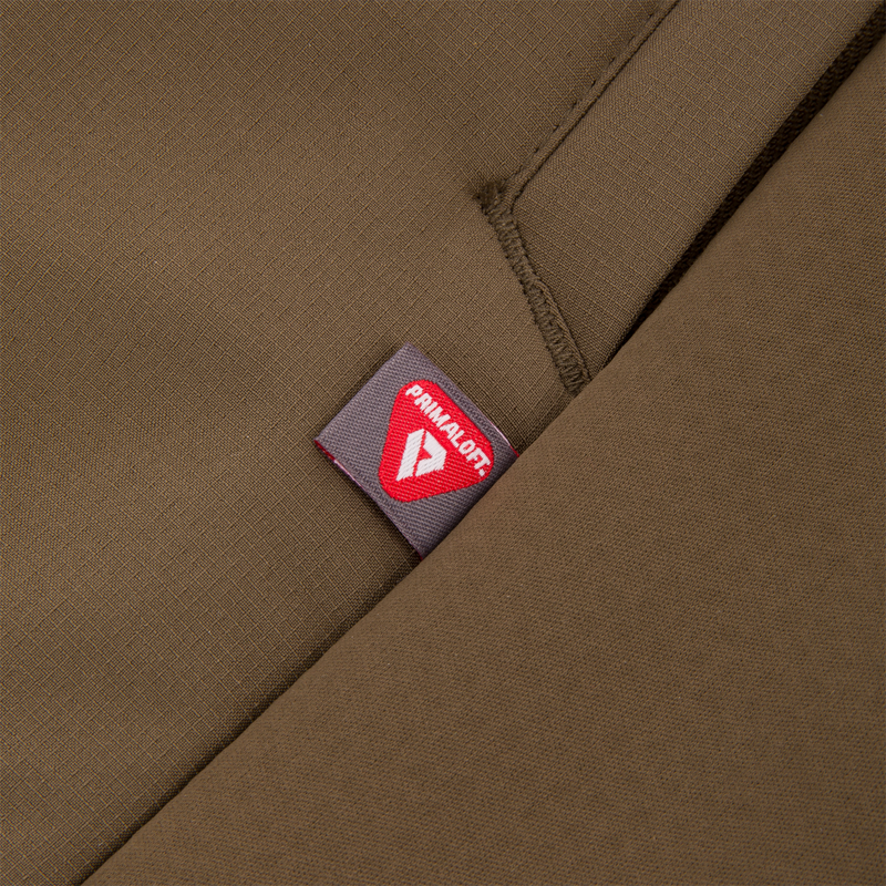 Close-up of the LST BMF Eqwader Full Zip with Primaloft, highlighting a seam with the PrimaLoft logo tag, emphasizing its premium insulation and outdoor durability.