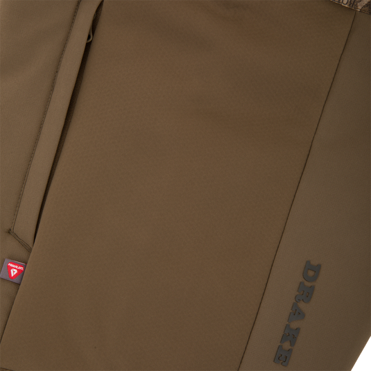 LST BMF Eqwader Half Zip Jacket with Primaloft, showcasing a brown soft-shell with camo lining, vertical seam pocket, and embossed PRAXE branding.