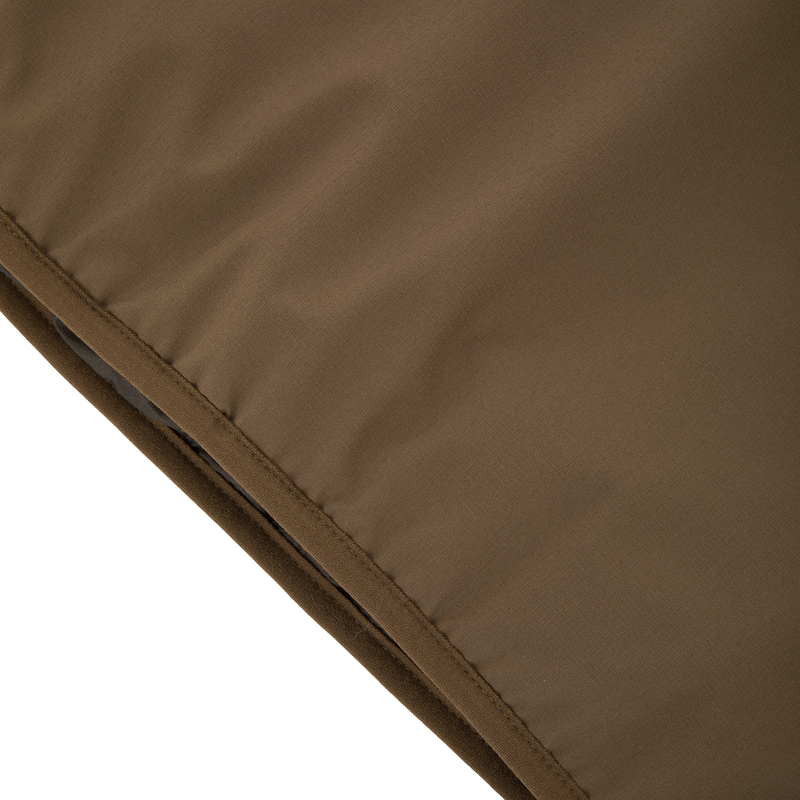 Close-up of the LST BMF Eqwader Half Zip Jacket with Primaloft, showcasing quilted, insulated fabric with a diagonal seam, ideal for warmth and weather resistance.