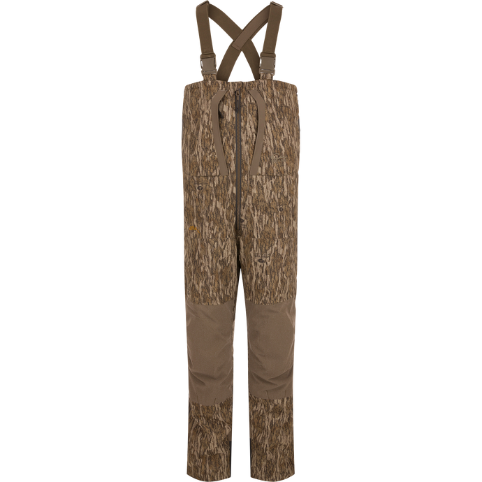 LST BMF Pit Bib with Primaloft: Camo-patterned hunting bib pants with reinforced brown fabric, adjustable suspenders, central front zipper, knee pads, and side zips for rugged performance.