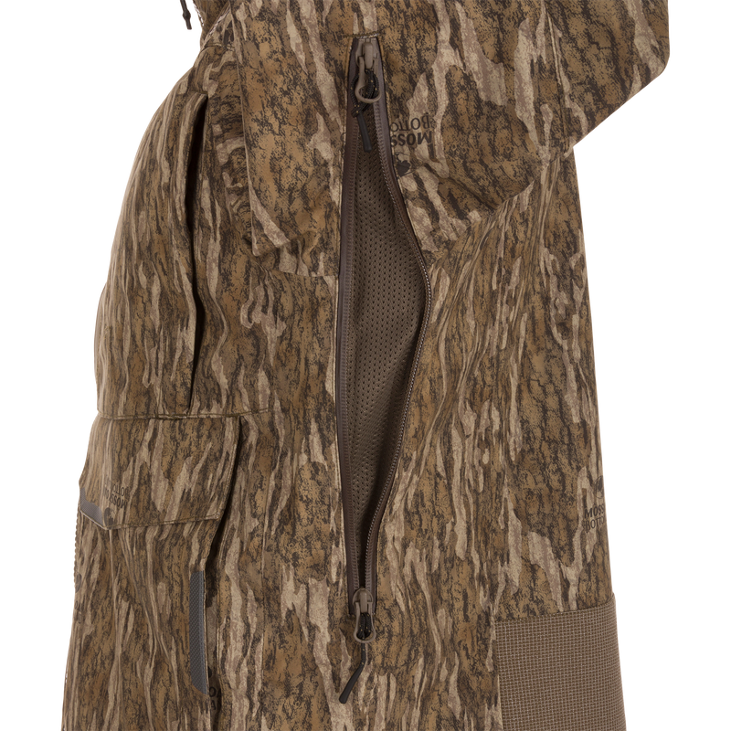 Close-up of the LST BMF Pit Jacket, highlighting its camouflage pattern, two-way zipper with mesh vent, and flap pocket for extreme hunting conditions.