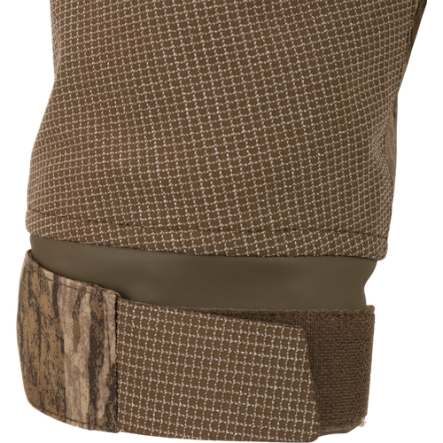 Close-up of the LST BMF 3-in-1 Pit Jacket's neoprene-lined camouflage cuff with Velcro adjustment, highlighting its waterproof design for hunting and outdoor durability.