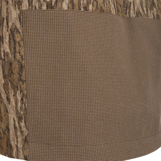 Close-up of the LST BMF 3-in-1 Pit Jacket with Primaloft, showcasing tree-bark camouflage and fine grid pattern fabrics, highlighting its rugged and versatile design.