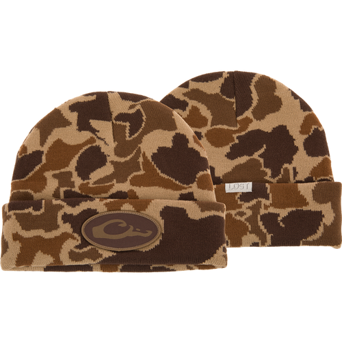 Drake X LOST Cold Front Watch Cap featuring camouflage and logo designs with a brown patch, jacquard construction, and a 4 flip cuff for warmth and style.