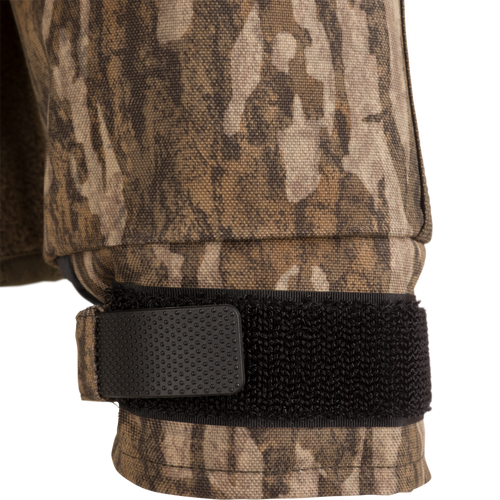 MST CommandXT Eqwader Full Zip Jacket close-up showing adjustable camo-patterned cuff with black Velcro strap and plastic tab, highlighting durability and weather-resistant features.
