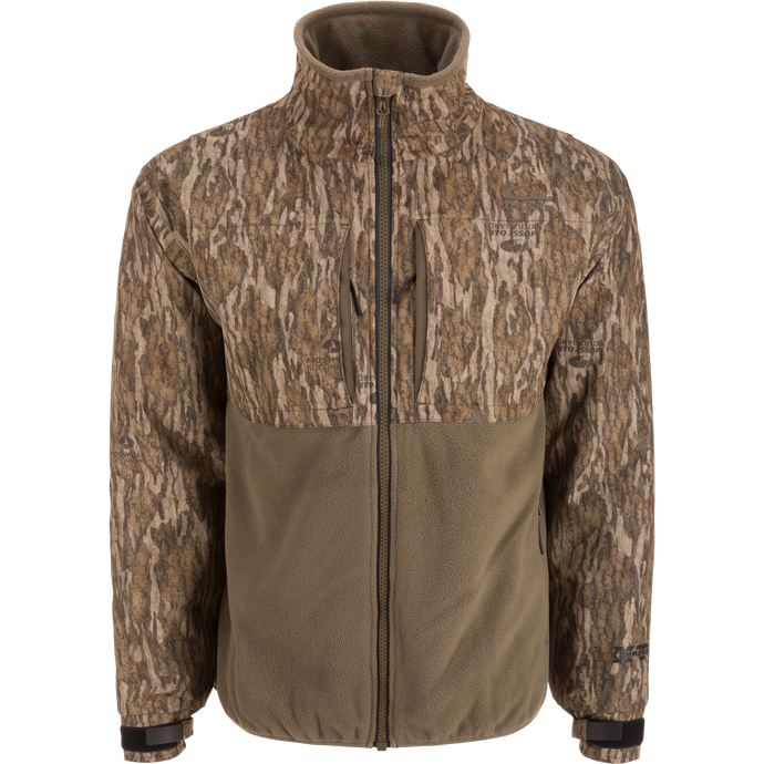 MST CommandXT Eqwader Full Zip Jacket with camouflage upper and olive-brown fleece lower, features zippered chest pockets and adjustable cuffs for outdoor enthusiasts.