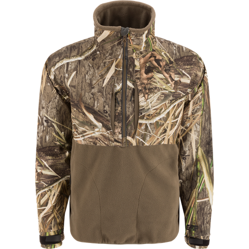 MST CommandXT Eqwader Half Zip Jacket with camo print upper, olive-brown fleece lower, zippered chest pockets, and adjustable cuffs, designed for waterproof and windproof protection.