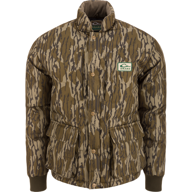 Throwback 80 Featherless Puffer Jacket with woodland camo, snap-button closure, ribbed cuffs, and large flap pockets, designed for outdoor enthusiasts and hunting.