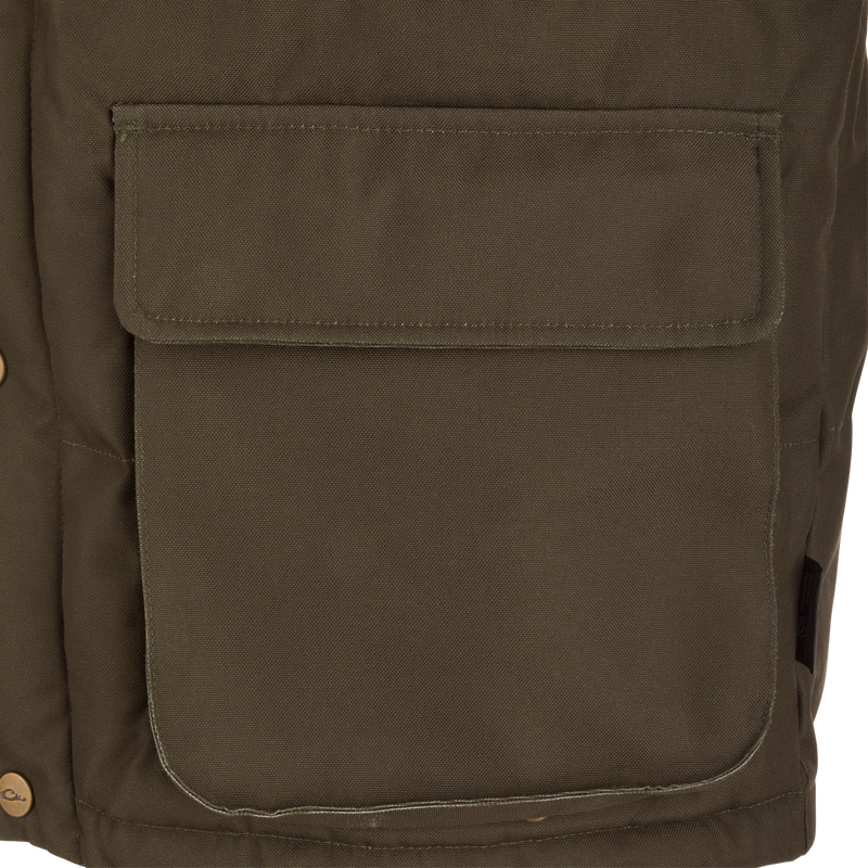 Close-up of the Throwback 80 Featherless Puffer Jacket's olive-green canvas front pocket with flap and snap-button, showcasing its durable and functional design.