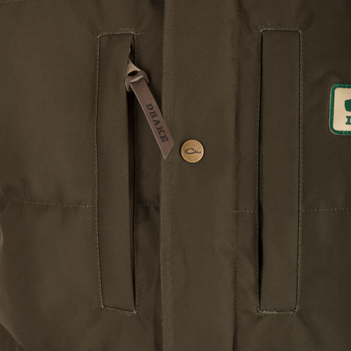 Throwback 80 Featherless Puffer Vest close-up showing durable zipper, fleece collar lining, and large pockets, highlighting waterproof and insulated features for optimal warmth.