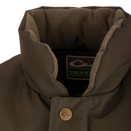 Close-up of the Throwback 80 Featherless Puffer Vest, highlighting its waterproof, windproof polyester fabric and large pockets, ideal for hunting and outdoor activities.