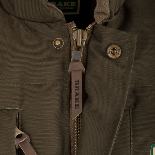 Close-up of the Throwback 80 Featherless Puffer Vest's durable brass zipper, highlighting its waterproof polyester material and fleece-lined collar for comfort.
