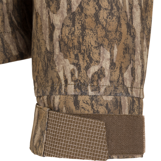 Close-up of the LST Hardline 3-in-1 Jacket's camo cuff with adjustable Velcro strap, showcasing its durable, adaptable design for hunting and outdoor use.