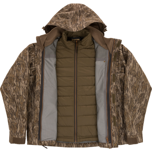LST Hardline 3-in-1 Jacket featuring a tree-bark camo shell with hood and an olive-green quilted liner, designed for adaptable, high-quality hunting protection.