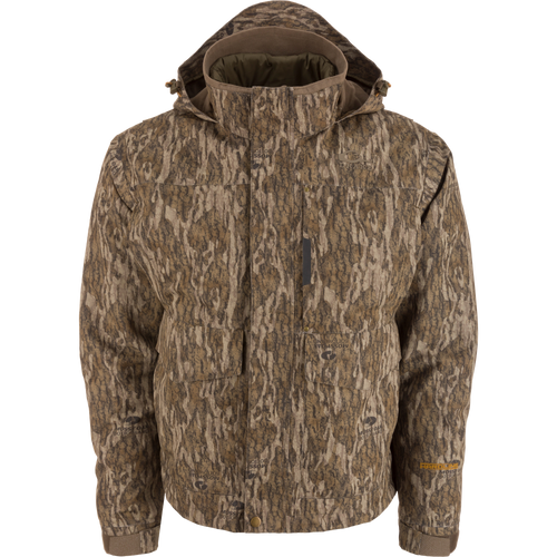 Men’s hooded hunting jacket, Purewhitelaneshop LST Hardline 3-in-1, featuring Mossy Oak camouflage, multiple pockets, storm flap, adjustable cuffs, and insulated lining for adaptable weather protection.