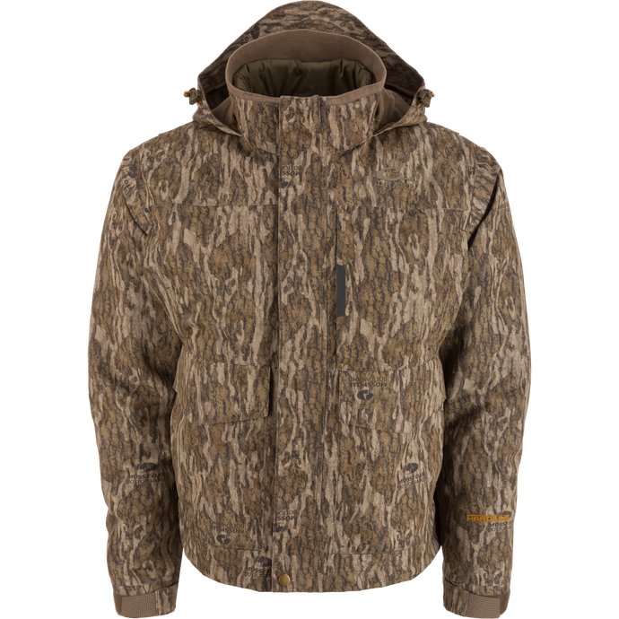Men’s hooded hunting jacket, Purewhitelaneshop LST Hardline 3-in-1, featuring Mossy Oak camouflage, multiple pockets, storm flap, adjustable cuffs, and insulated lining for adaptable weather protection.