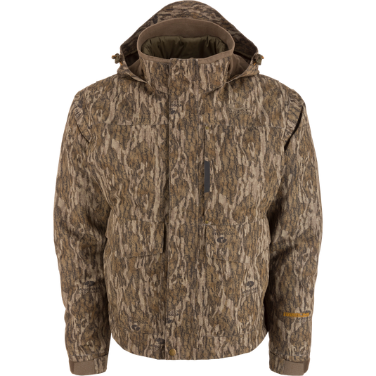 Men’s hooded hunting jacket, Purewhitelaneshop LST Hardline 3-in-1, featuring Mossy Oak camouflage, multiple pockets, storm flap, adjustable cuffs, and insulated lining for adaptable weather protection.