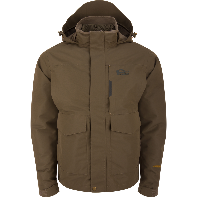 LST Hardline 3-in-1 Jacket by Drake, featuring a high collar, hood, and multiple pockets, designed for adaptable outdoor protection in hunting and fishing activities.