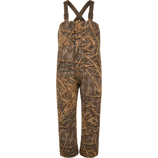LST Hardline Insulated Bib with adjustable straps, grass camo print, waterproof polyester, synthetic down insulation, tricot-lined pockets, and articulated knees for waterfowl hunting.