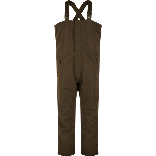 LST Hardline Insulated Bib, waterproof chest-high overalls with adjustable straps, zippered pockets, and articulated knees, designed for warmth and mobility in harsh environments.