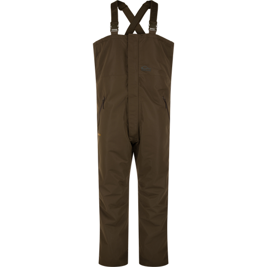 LST Hardline Insulated Bib, waterproof chest-high overalls with adjustable straps, zippered pockets, and articulated knees, designed for warmth and mobility in harsh environments.