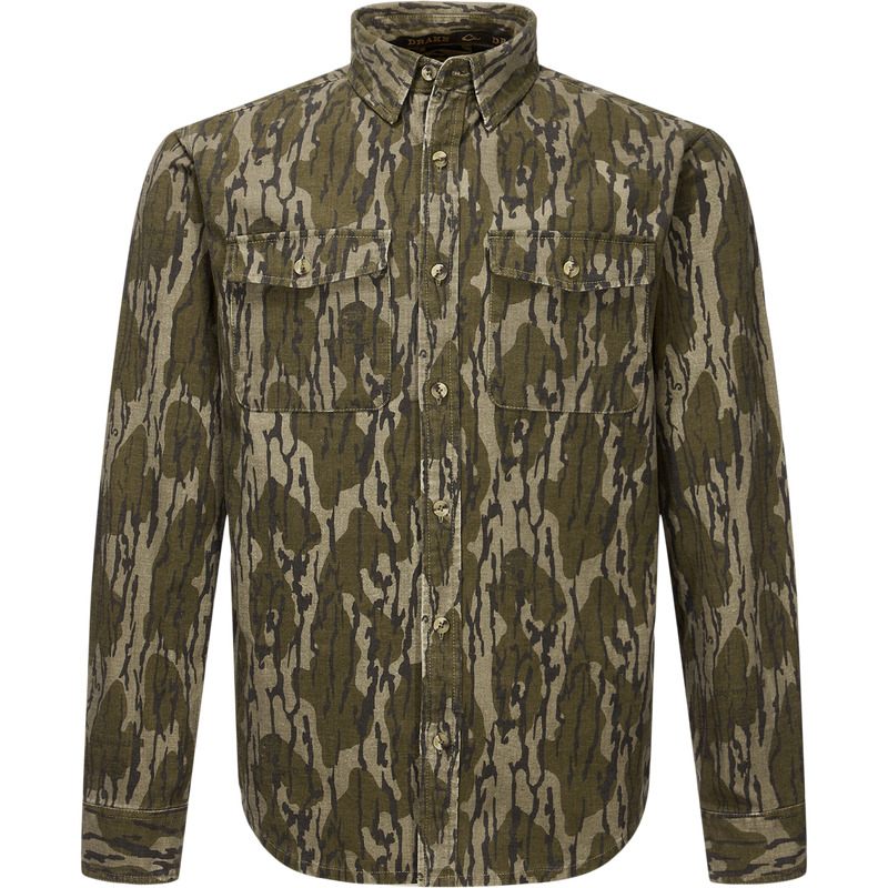 Throwback 80 Button Down Shirt with camouflage print, two chest flap pockets, and reinforced forearms, crafted from durable 8.3oz cotton twill, ideal for rugged outdoor wear.