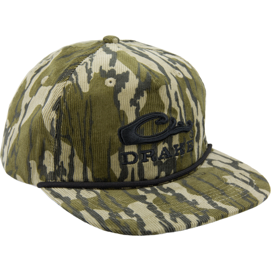 Drake X Lost Hat Goat Rope Corduroy Cap featuring camouflage corduroy, black-embroidered DRAKE logo, and paracord detail for stylish outdoor flair.