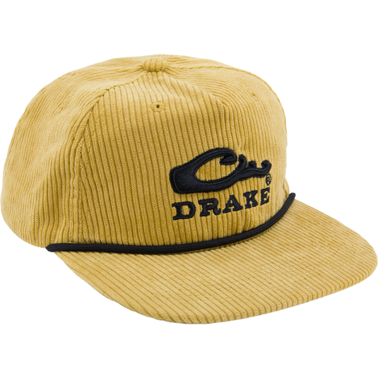 Mustard-yellow corduroy cap with Drake logo, black piping, paracord rope detail on mid-crown, offering rugged style and comfort.