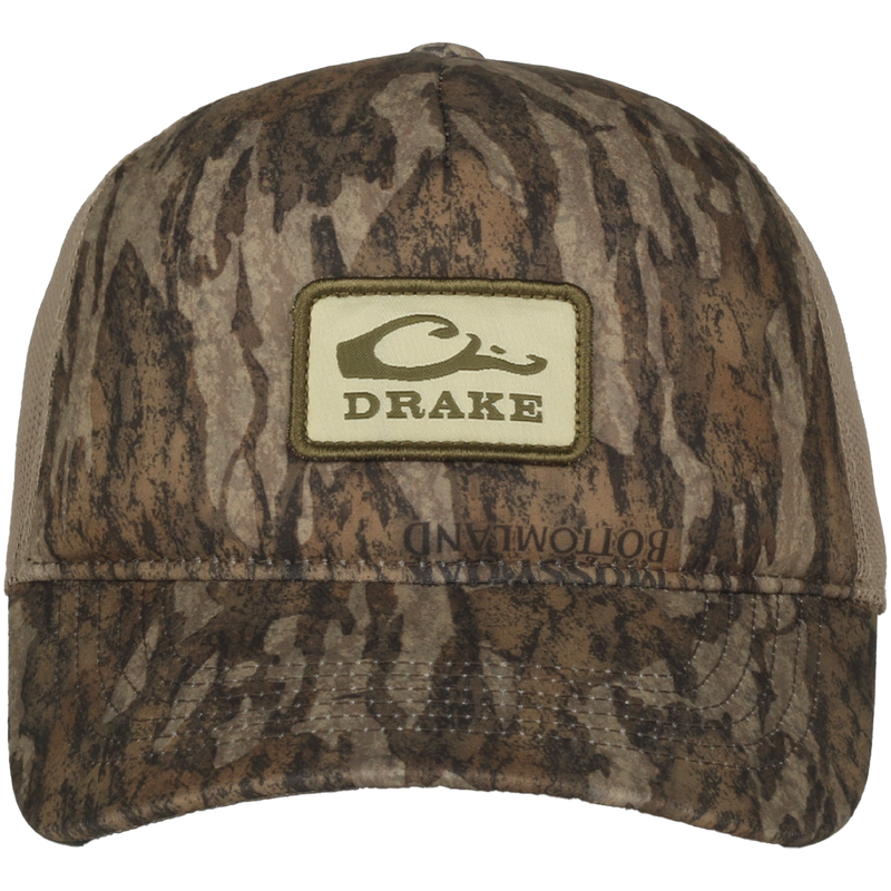 Foam Trucker Logo Cap featuring camo pattern, curved brim, Drake logo patch, foam front, and mesh back for breathability and comfort.