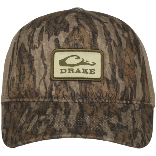 Foam Trucker Logo Cap featuring camo pattern, curved brim, Drake logo patch, foam front, and mesh back for breathability and comfort.