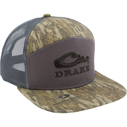 Drake X LOST SA7AGE 7 Panel Cap with camo front, mesh sides, and stitched logo. Features structured silhouette, snap-back closure, and mid-crown profile for versatile wear.