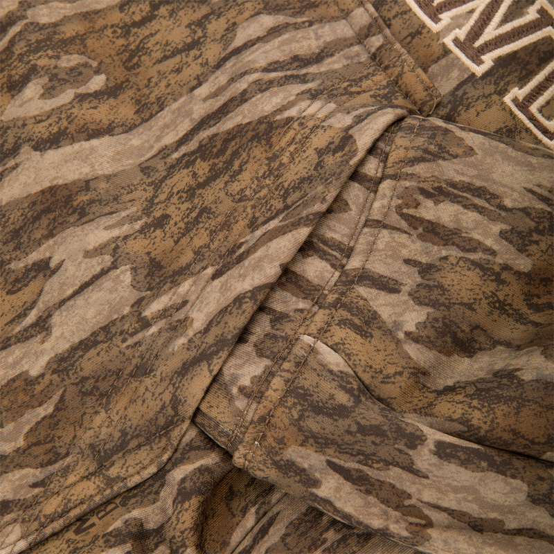 Close-up of the Youth Performance Hoodie with tiger-stripe camouflage, showcasing stitched seams, kangaroo pocket, and embroidered details, designed for comfort and versatility in active use.
