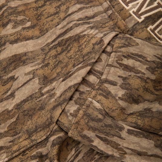 Close-up of the Youth Performance Hoodie with tiger-stripe camouflage, showcasing stitched seams, kangaroo pocket, and embroidered details, designed for comfort and versatility in active use.