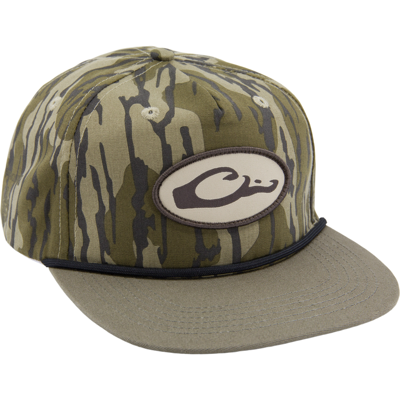 Drake X Lost Hat Hybrid Goat Rope Cap features a tiger-stripe camo design, mid-crown, 5-panel build, black cord, and adjustable snap-back for a secure fit.