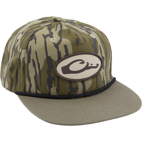 Drake X Lost Hat Hybrid Goat Rope Cap features a tiger-stripe camo design, mid-crown, 5-panel build, black cord, and adjustable snap-back for a secure fit.