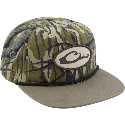 Drake X Lost Hat Hybrid Goat Rope Cap featuring woodland-camo pattern, oval C logo patch, olive brim, and snap-back closure for adjustable fit.