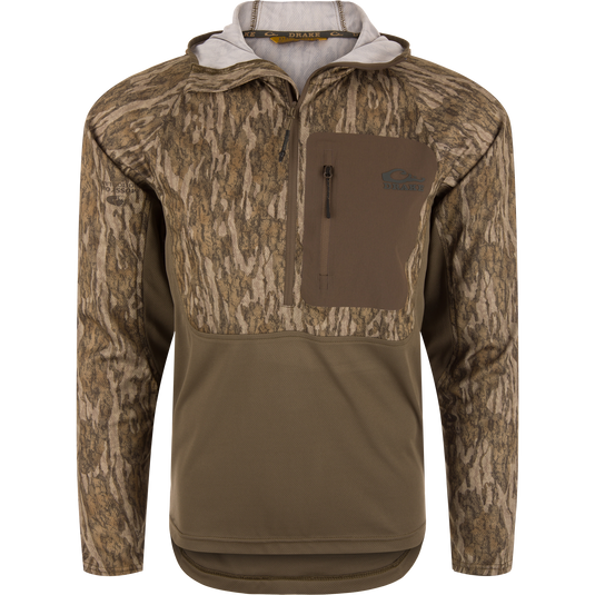 EST Performance Half-Zip Hoodie featuring a camouflage design, solid-color lower panel, chest pocket with Drake logo, and ergonomic thumbholes for enhanced performance and mobility.